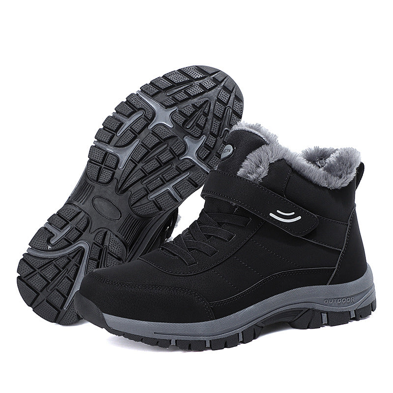 Black snow boots with faux fur collar and textured rubber traction outsole