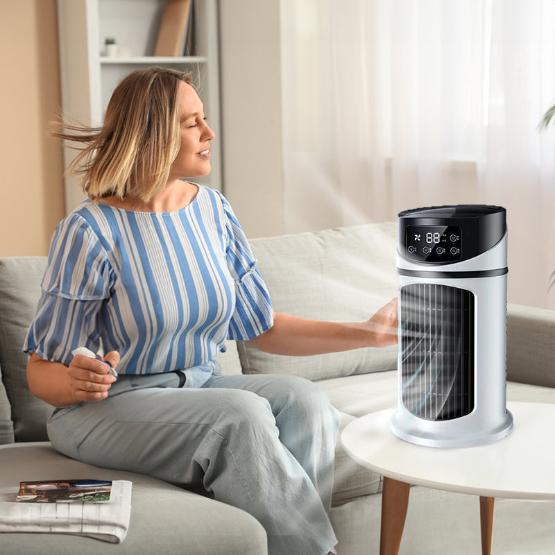 White and black tower air cooler fan with front grille and dark digital control top