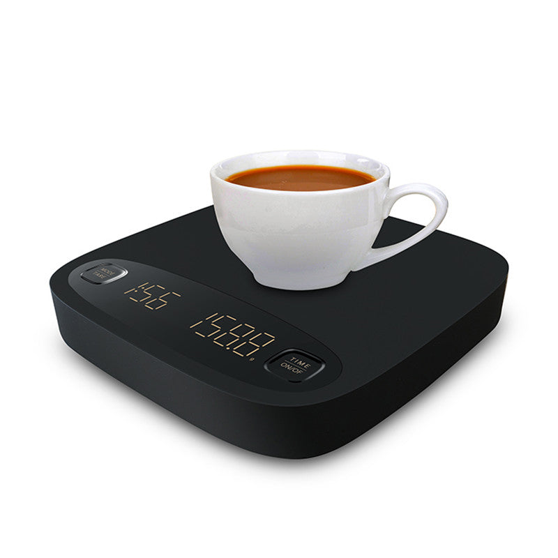 Black coffee electronic scale with a white cup placed on top
