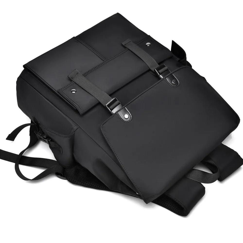 Black PU leather backpack with front flap, buckles, and layered front panel pockets