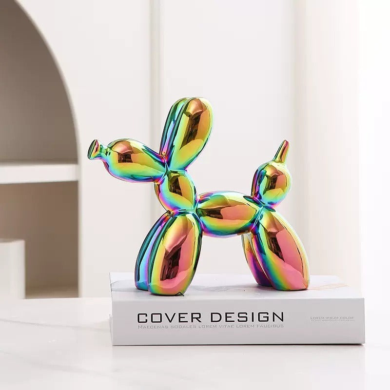 Rainbow iridescent balloon dog figurine standing on a pedestal