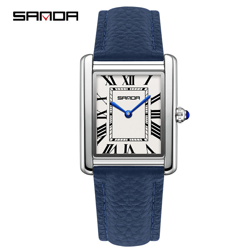 Square quartz watch with blue leather strap and silver case; light Roman numeral dial.