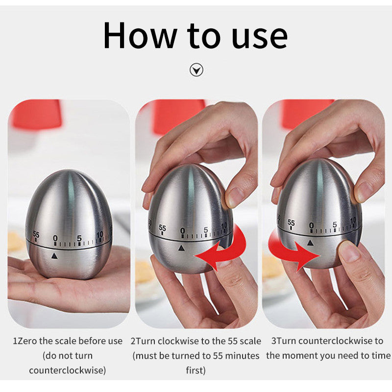 Egg-shaped mechanical kitchen timer with hands turning the top to set minutes