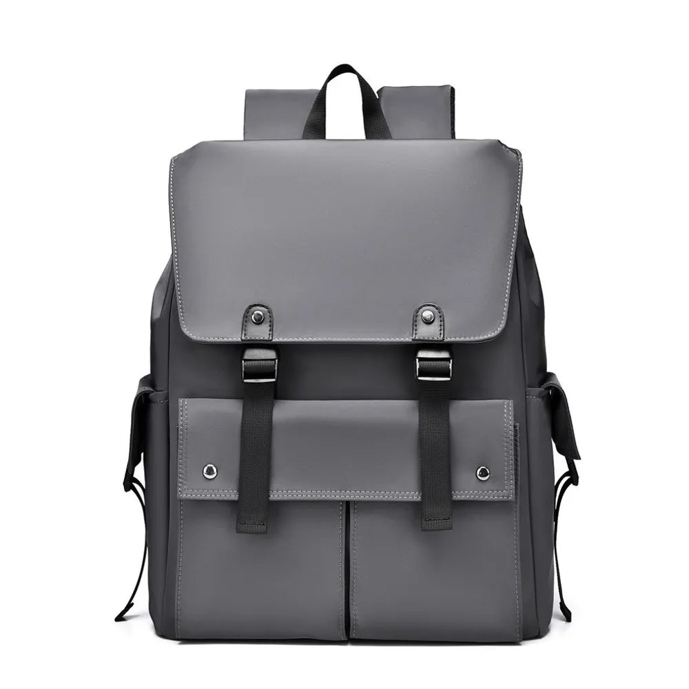 Gray PU leather backpack front view with flap closure, buckled straps, and front pocket panels