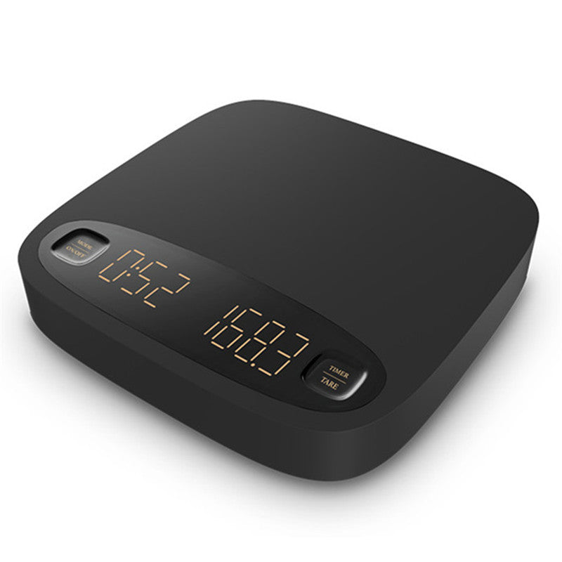 Black coffee electronic scale angled view with glowing display and timer/tare buttons