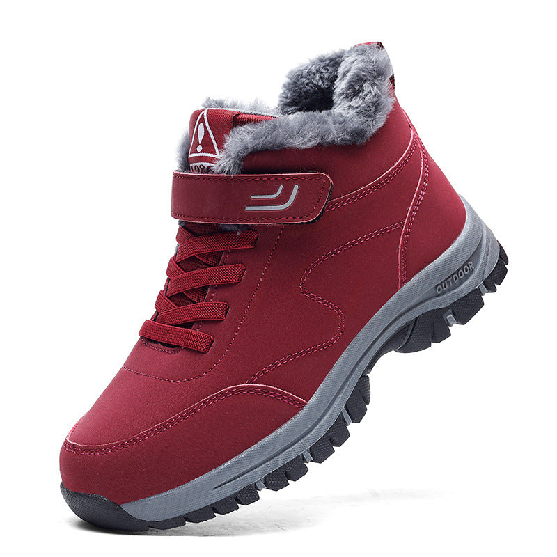 Red lace-up snow boots with faux fur lining and rugged rubber tread outsole