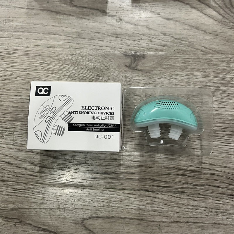 Green electronic anti snoring device with mouthpiece in clear plastic blister.