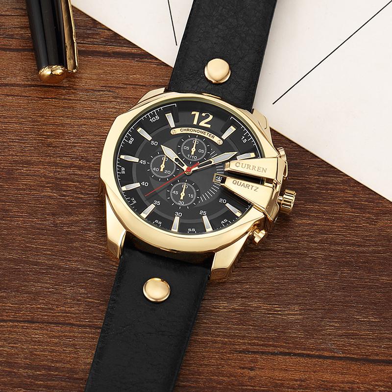 Men's quartz wristwatch with black dial, gold-tone case, and black leather strap