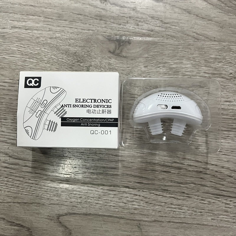 White electronic anti snoring device with mouthpiece in clear plastic blister.