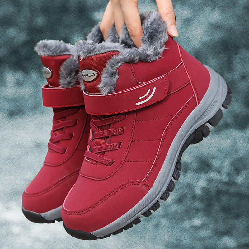 Red lace-up snow boots with faux fur lining, hook-and-loop strap, rubber sole