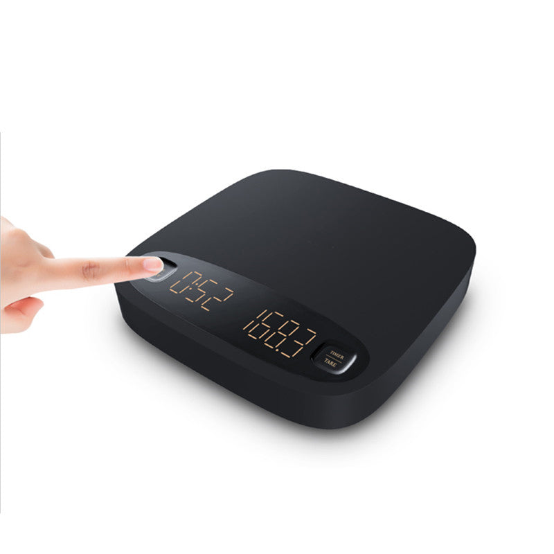 Black coffee electronic scale with digital display and front buttons