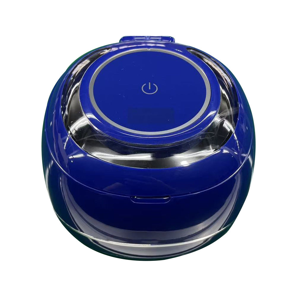 Blue ultrasonic denture cleaner with clear lid and round power button on top
