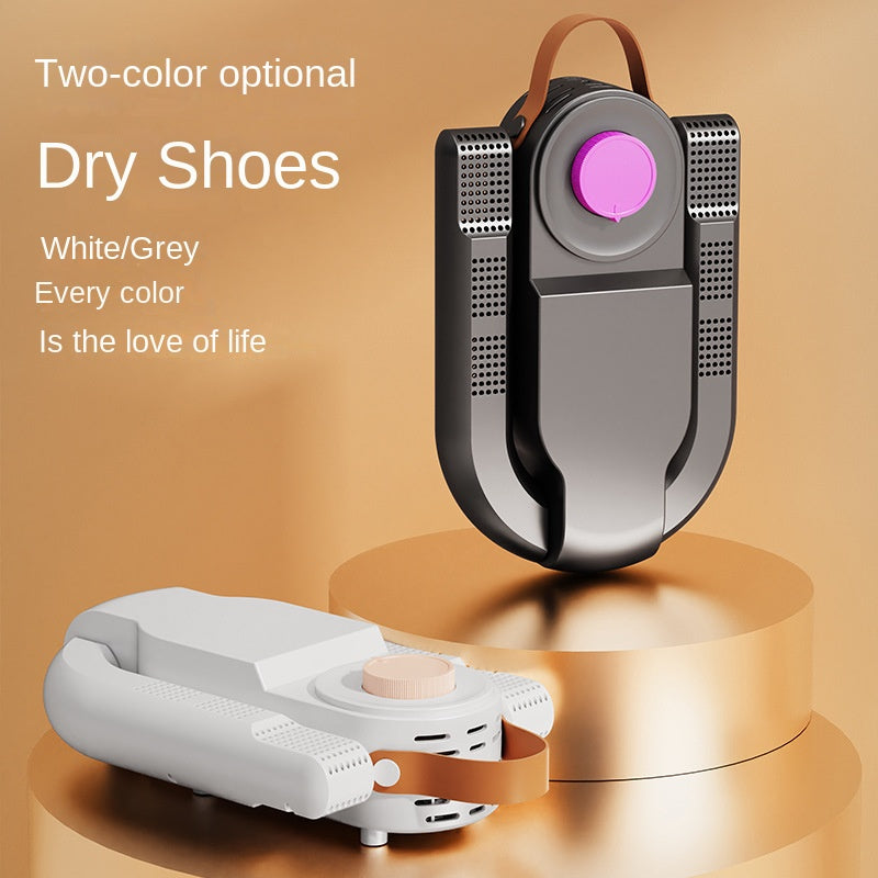 Shoe dryer with white base and black sides, circular pink UV indicator, perforated vents