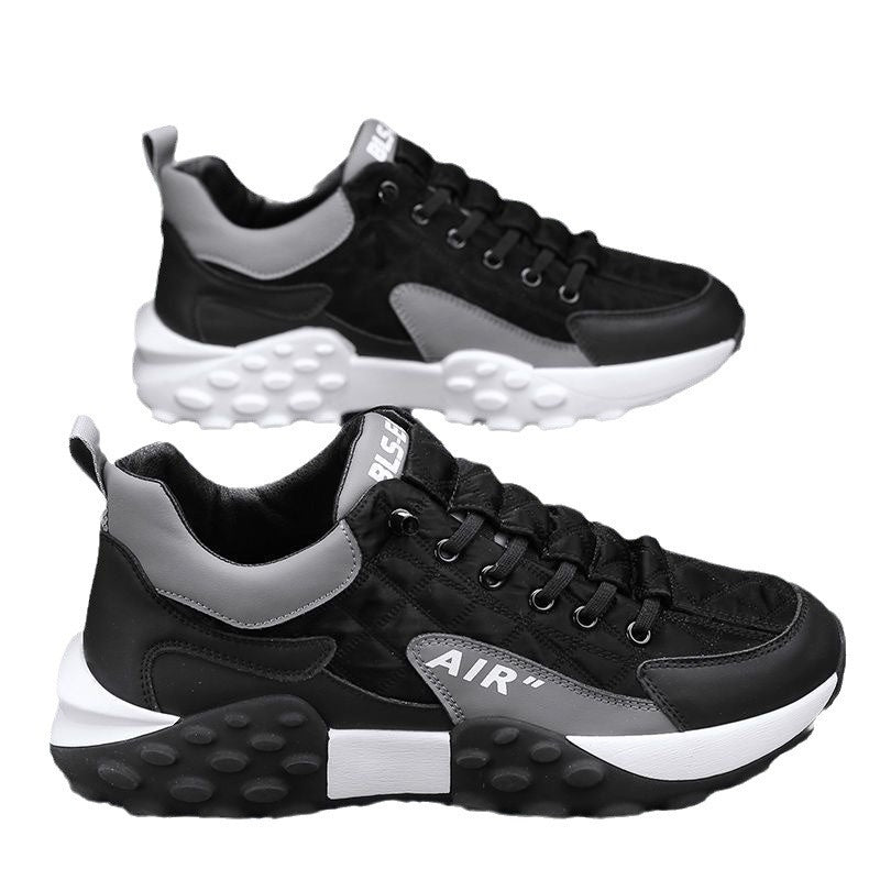 Men's black lace-up sneakers with gray accents, AIR logo, and chunky white rubber sole