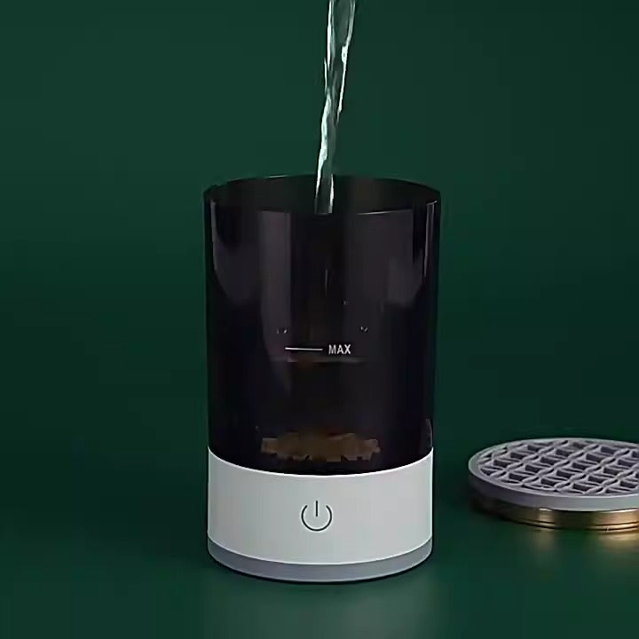 Electric brush washer with dark clear tank, MAX fill line, and power button