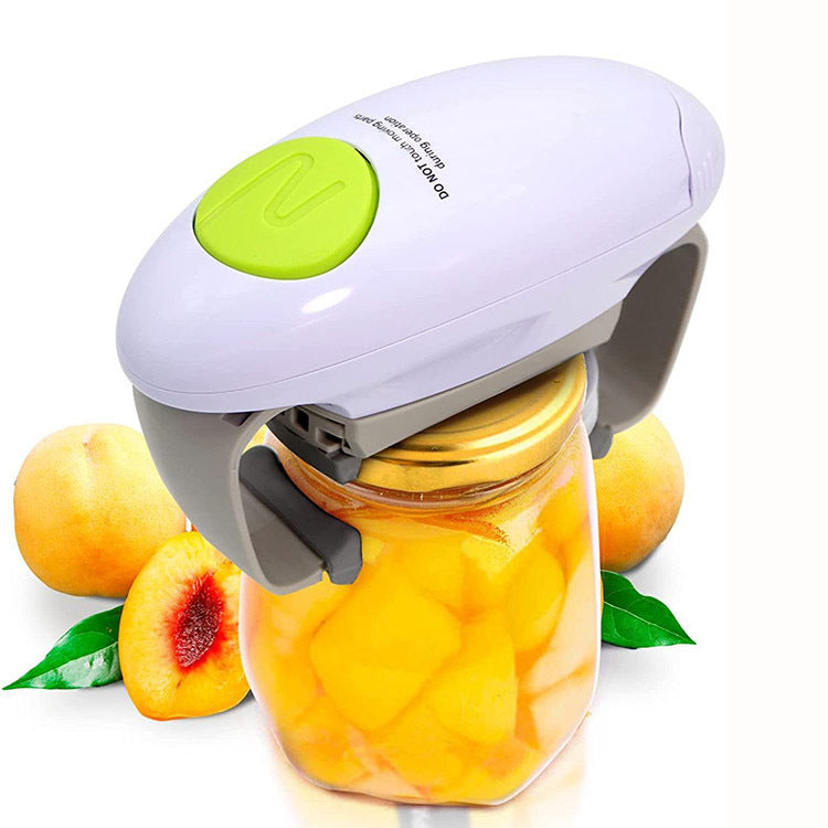 Electric bottle opener with green start button holding a glass jar lid and fruit