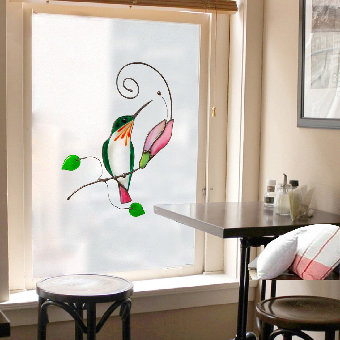 Cartoon bird window decal with green, orange and pink birds on a swirling branch design