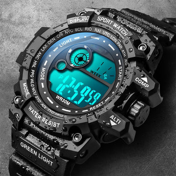 Black sporty digital student watch with teal backlight and green light strap detail