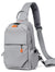 Gray crossbody sling backpack bag with orange zipper pulls and adjustable shoulder strap