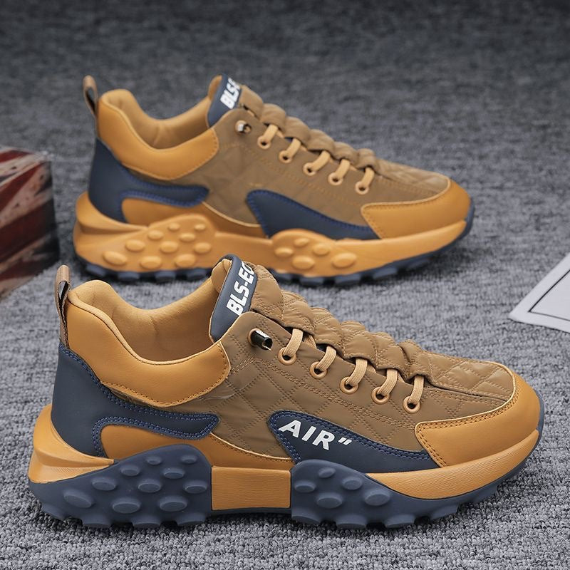 Men's tan-and-blue lace-up sneakers with AIR logo and chunky bubble-tread sole