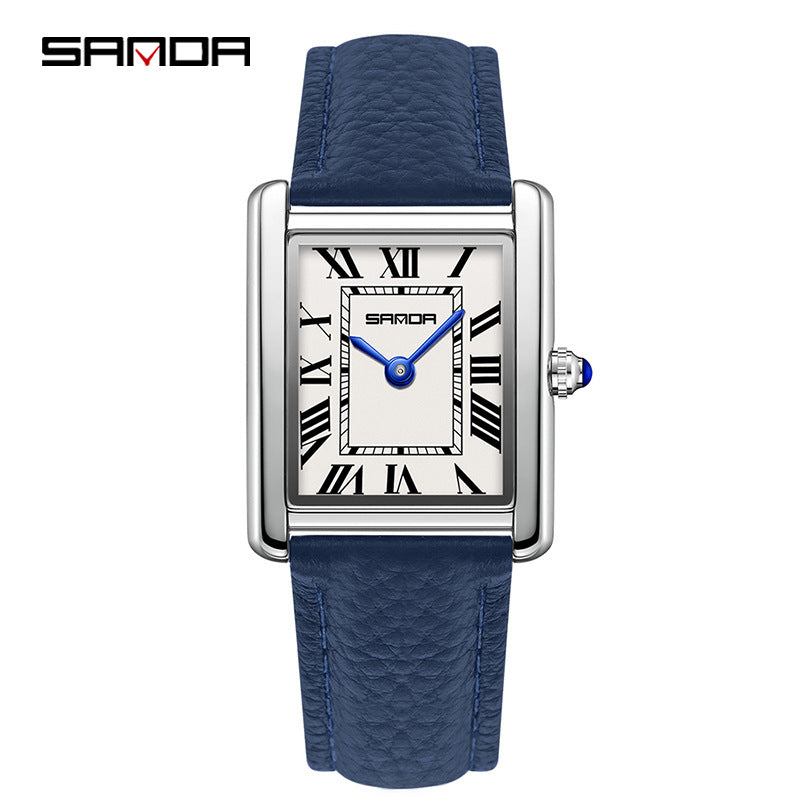 Square quartz watch with blue leather strap and silver case; light Roman numeral dial.