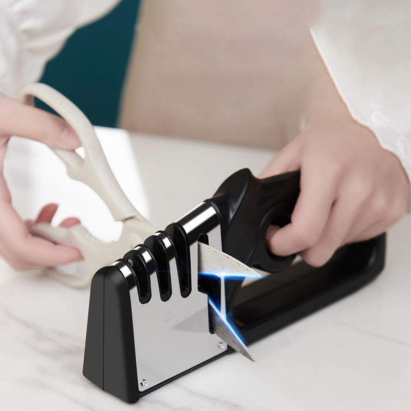Knife blade sharpened at fixed angle with black knife sharpener and sharpening slots