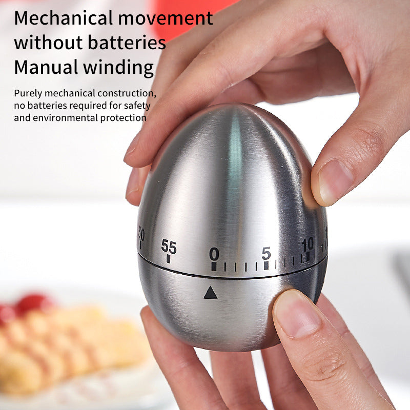 Stainless steel egg-shaped mechanical kitchen timer with numbered countdown dial