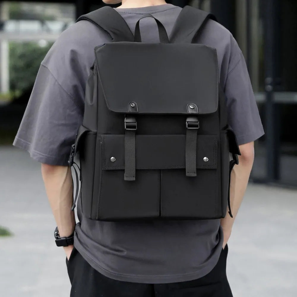 Gray PU leather backpack with front flap, buckled straps, and side drawstring cords