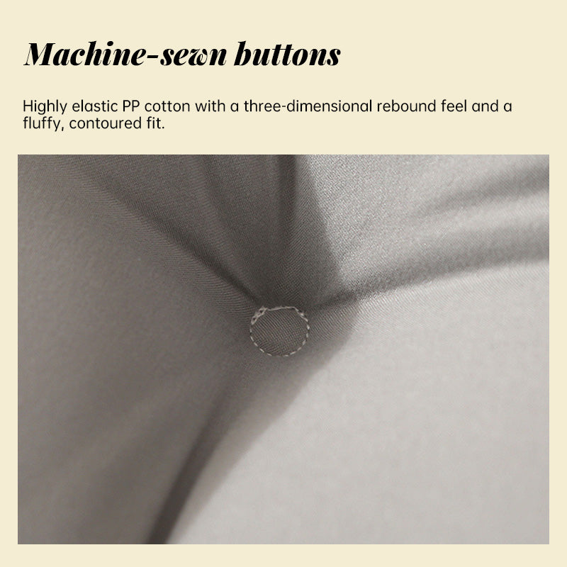 Bed backrest cushion fabric with machine-stitched button detail on the tufting seam.