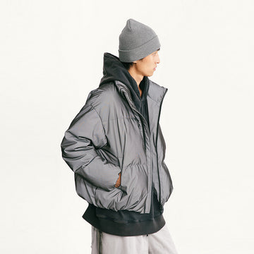Black stand-collar down jacket with zip front and padded reflective texture