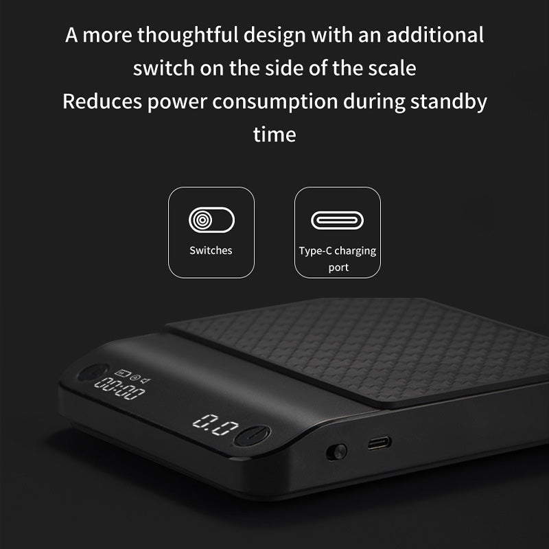 Black coffee electronic scale with textured top, side ports, and digital display