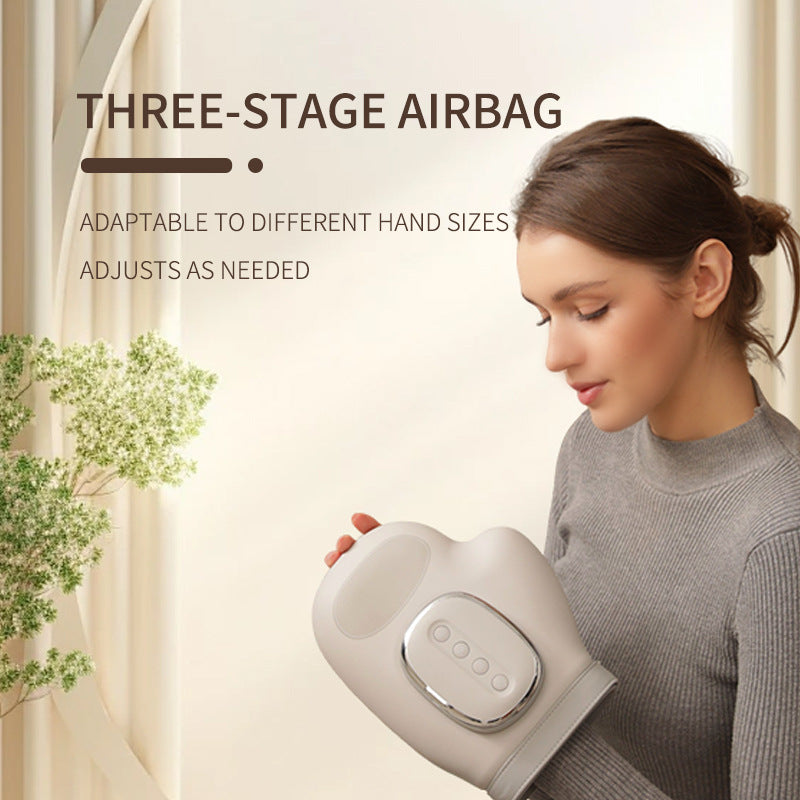Light gray air pressure hand massager with heated control panel and wrist strap