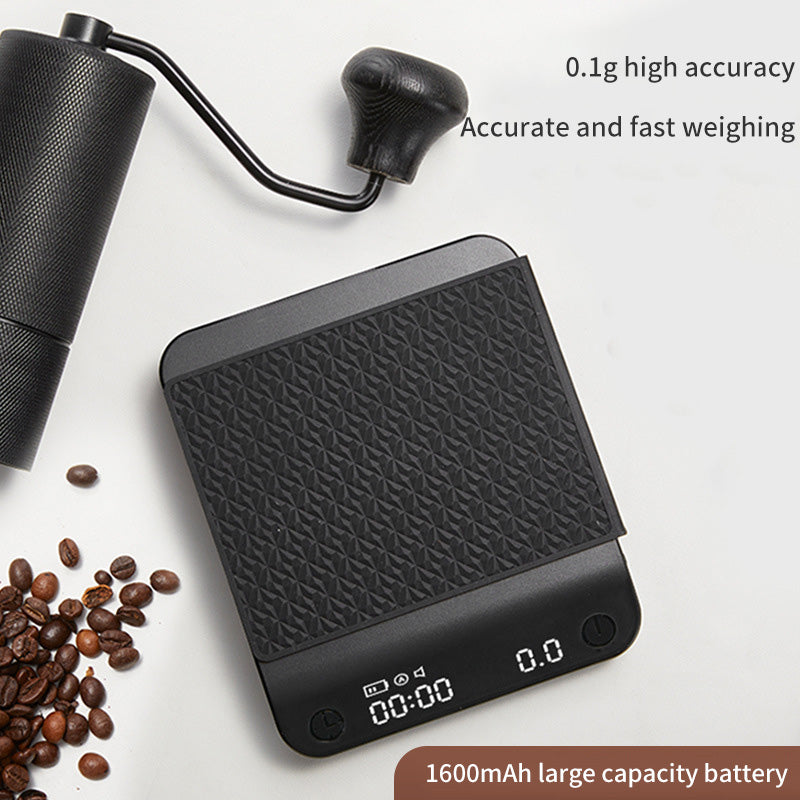 Black coffee electronic scale with textured weighing surface and 0.0 digital display