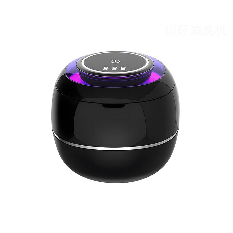 Black countertop ultrasonic denture cleaner with top control panel and purple light
