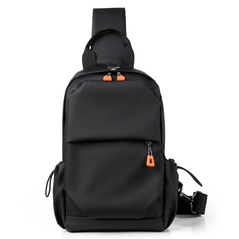 Black crossbody sling backpack bag front view with orange zipper pulls and shoulder strap