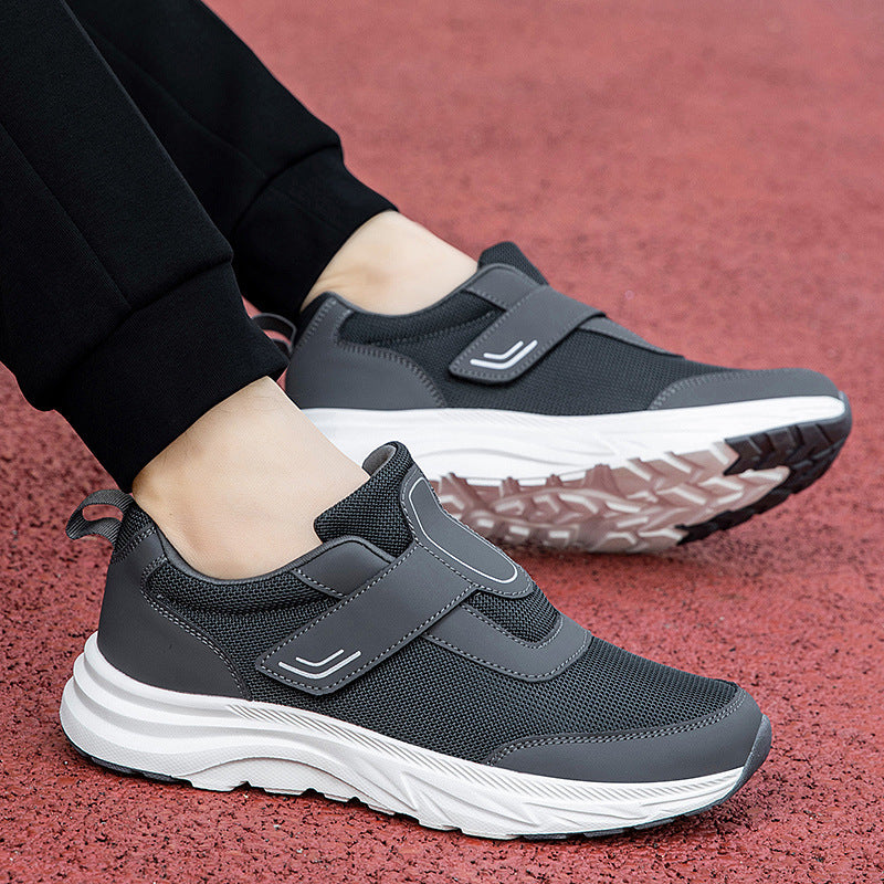 Men's walking shoes, charcoal gray knit with hook-and-loop straps and white sole